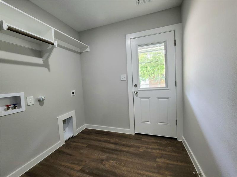 Walk in laundry room with washer and dryer hookup