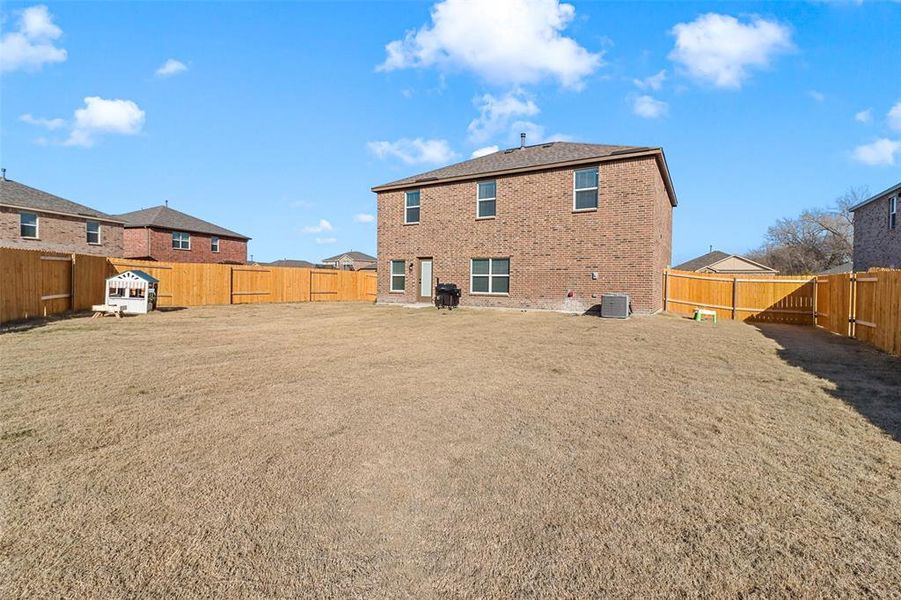 Back of property with central air condition unit