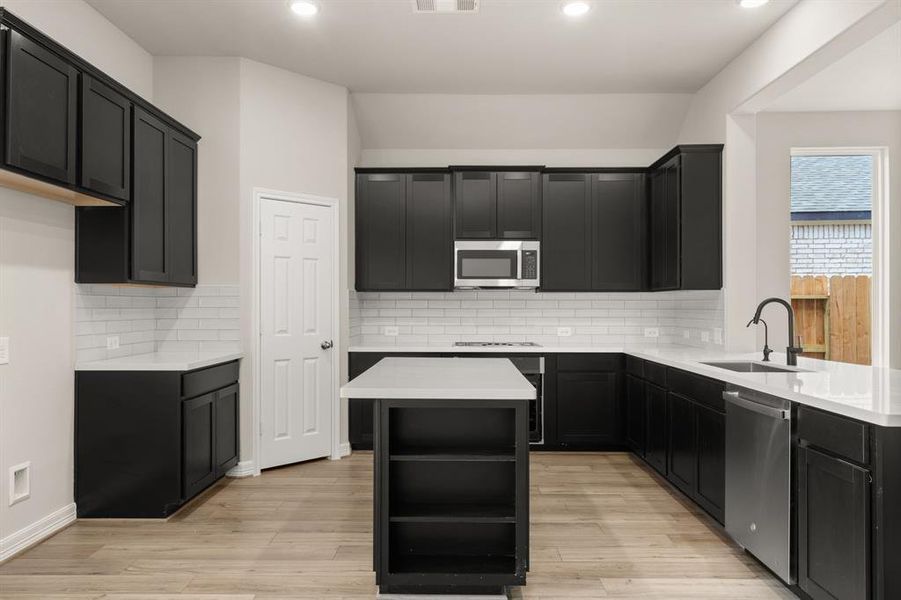 This kitchen is not only a functional space but also has ample storage. Whether you're a seasoned chef or just love to gather and enjoy good food, this kitchen is a dream come true.