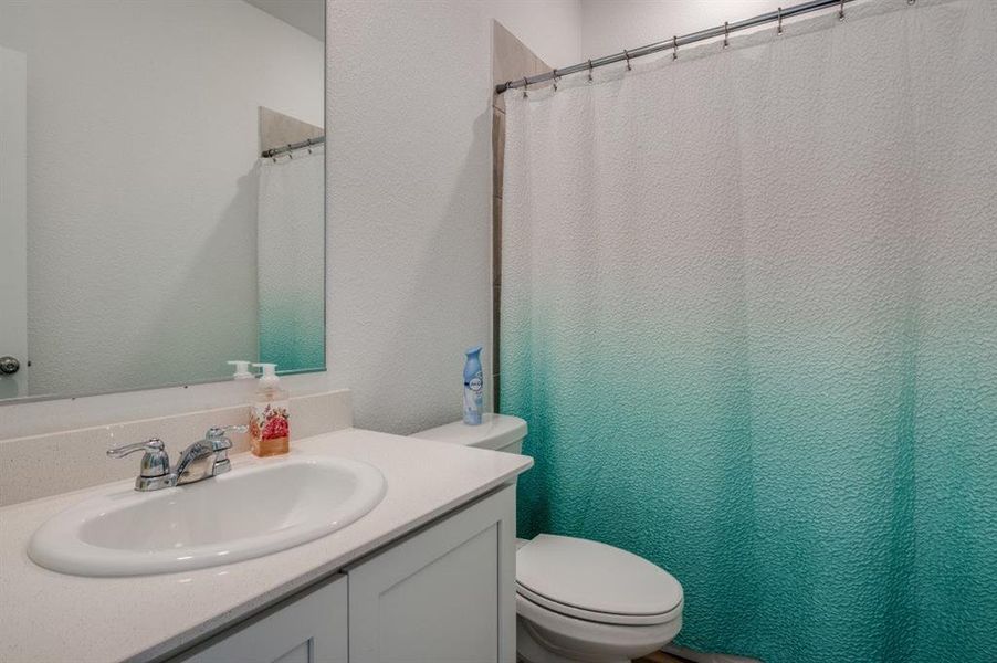 Bathroom with vanity and toilet