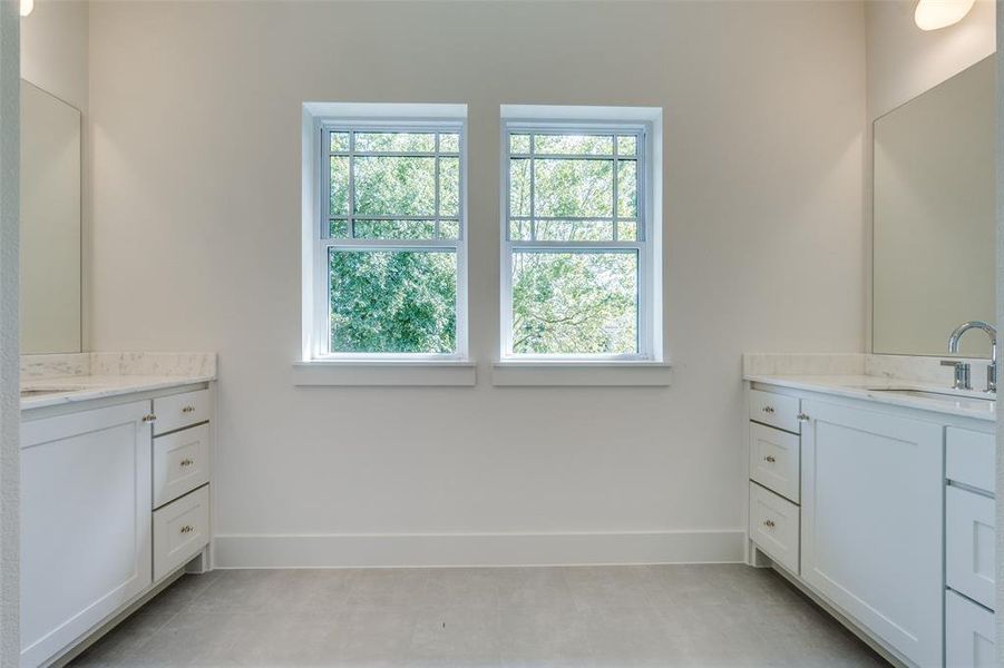 separate vanities with natural lighting