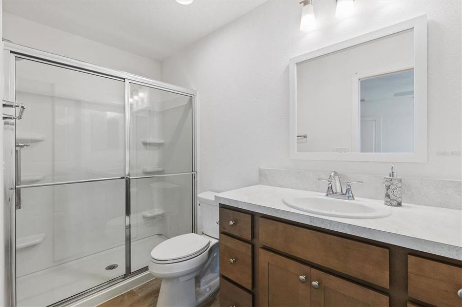 EN-SUITE BATHROOM WITH UPGRADED SHOWER DOORS