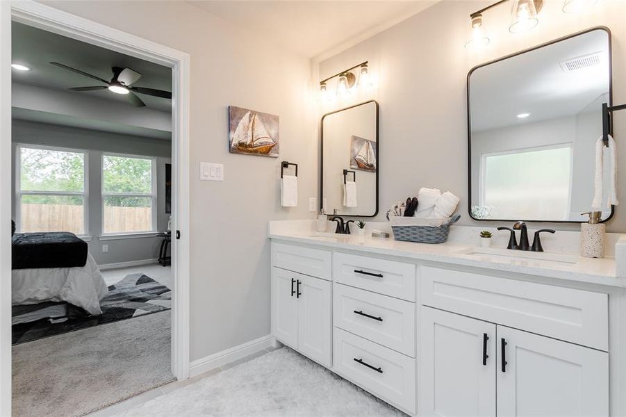 Bathroom featuring vanity and ceiling fan