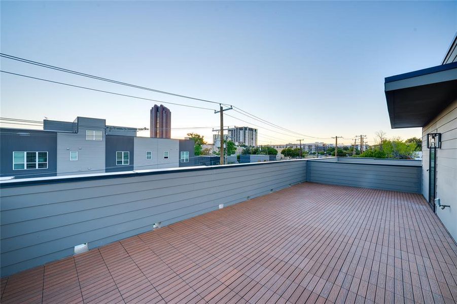 Patio terrace at dusk with a balcony