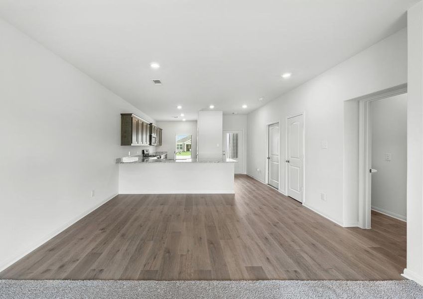 The dining room sits right off of the kitchen has a large window.