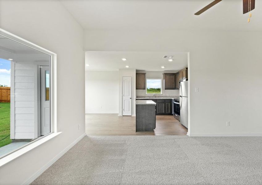 The open layout connects the family room with the kitchen and dining room.