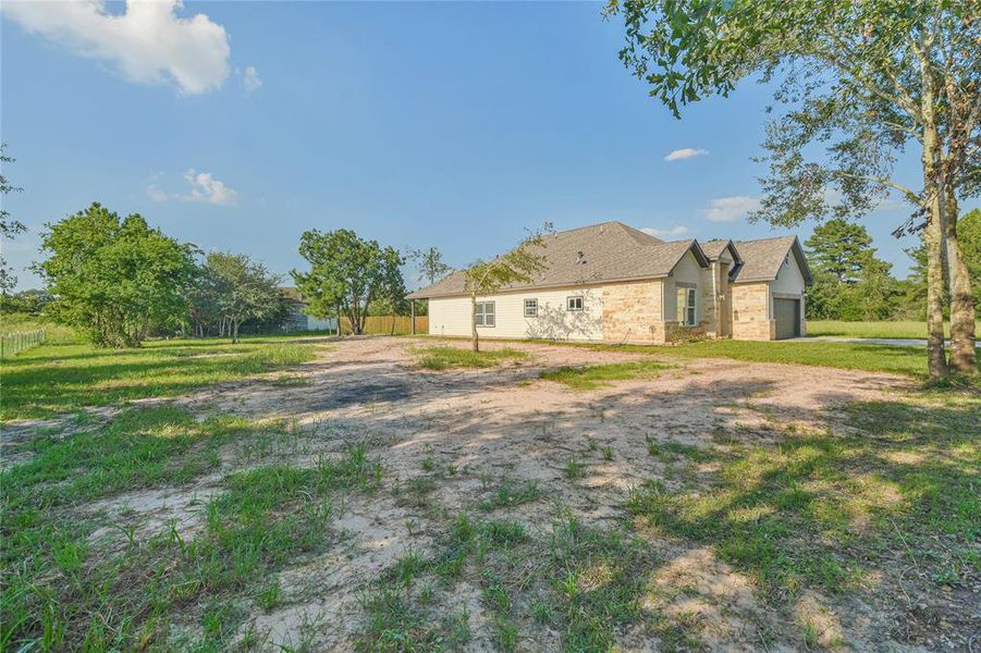 View of side yard with plenty of space for whatever you want to build.