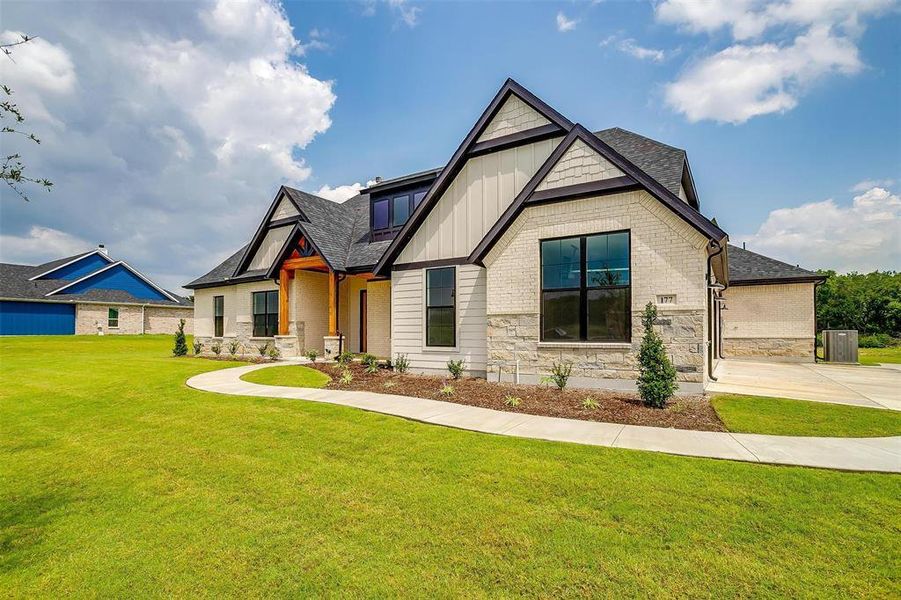 Craftsman-style house featuring a front yard