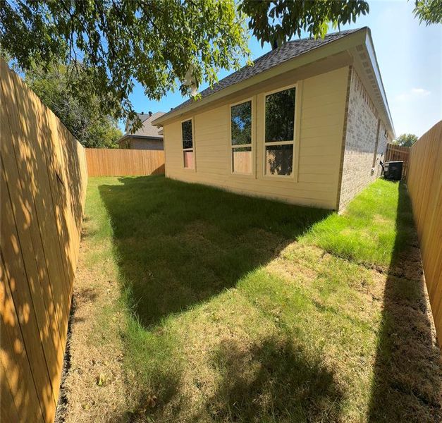 View of home's exterior with a lawn