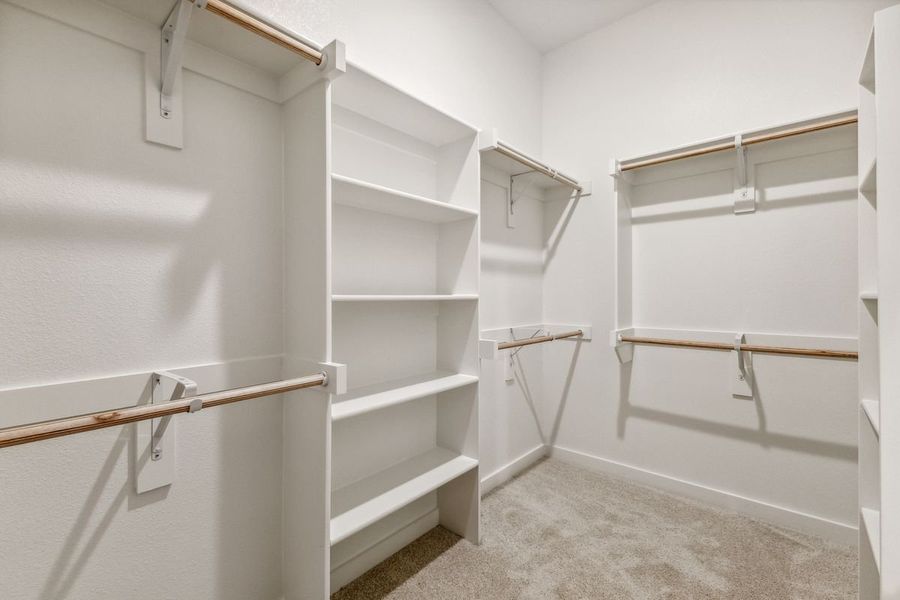 Primary Closet in the Cedar home plan by Trophy Signature Homes – REPRESENTATIVE PHOTO