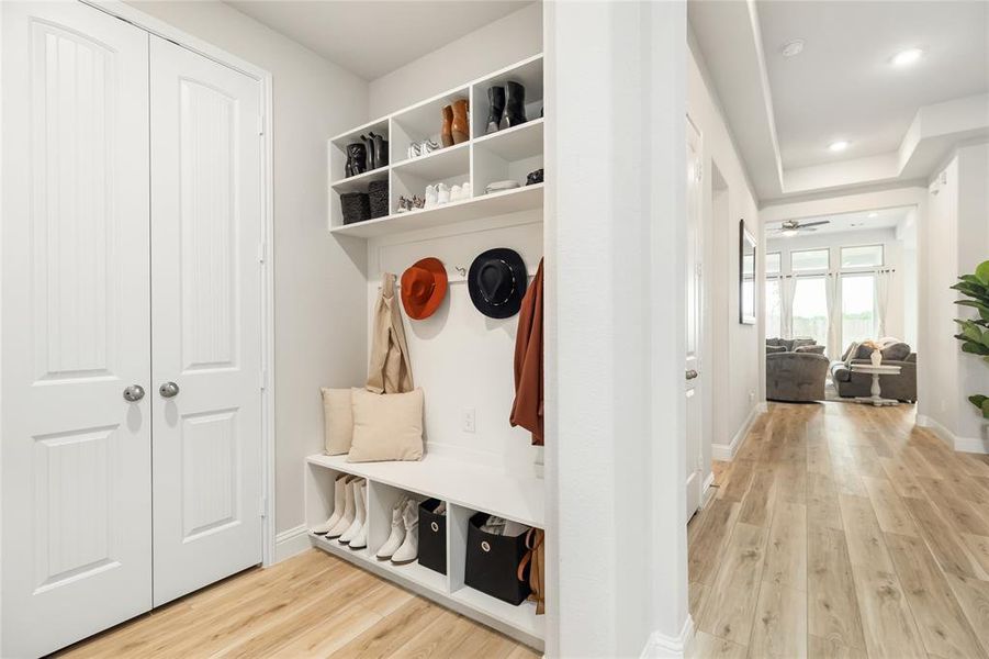 Conveniently built-in hall storage helps manage coats and bags.