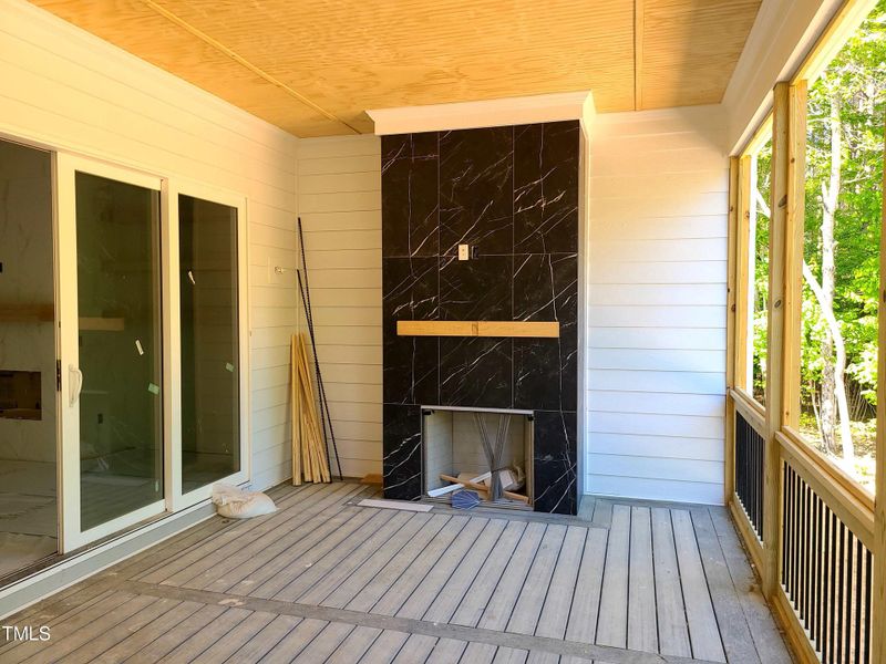 screen porch with fireplace