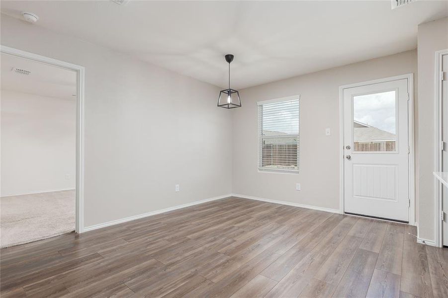 Spare room with hardwood / wood-style flooring