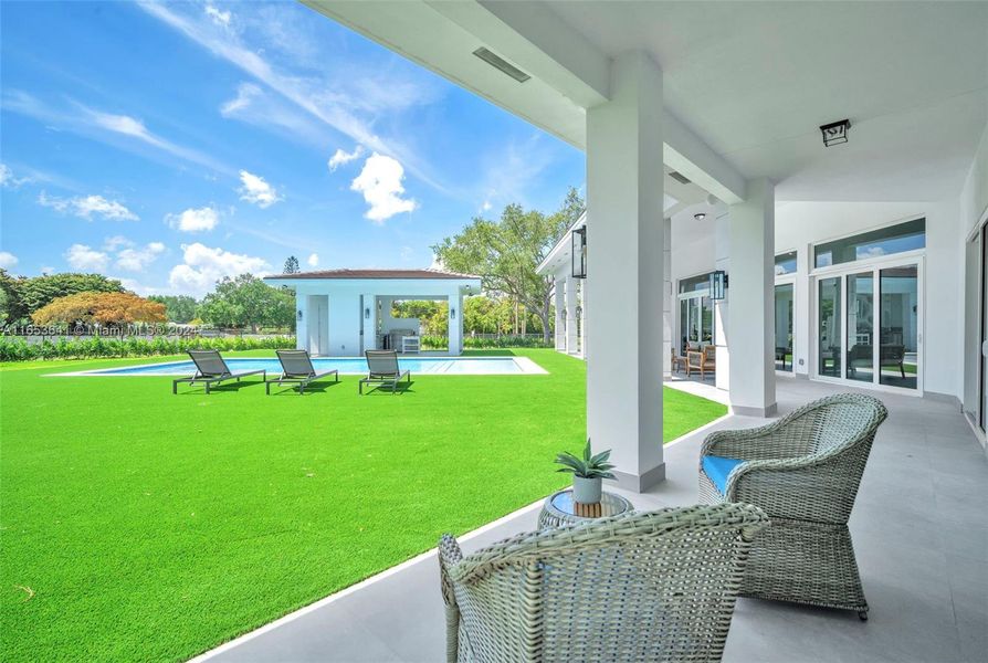 Master bedroom covered terrace with pool view