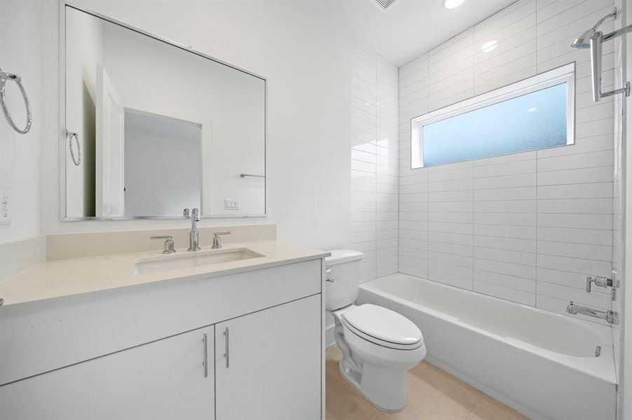 Beautiful full bathroom attached to top floor third bedroom .