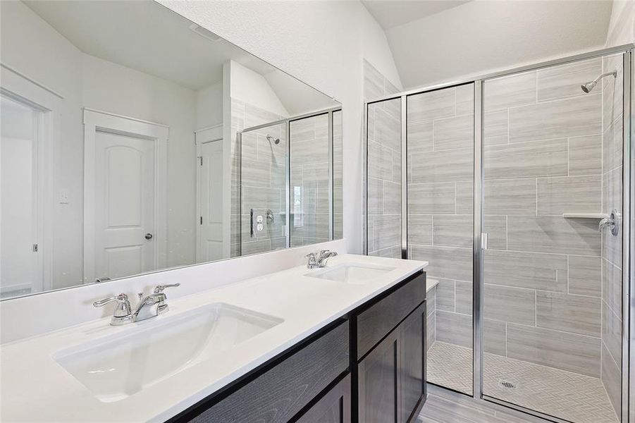 Bathroom featuring walk in shower, wood-type flooring, and vanity