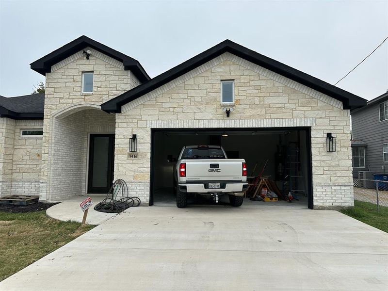 View of front of property featuring a garage