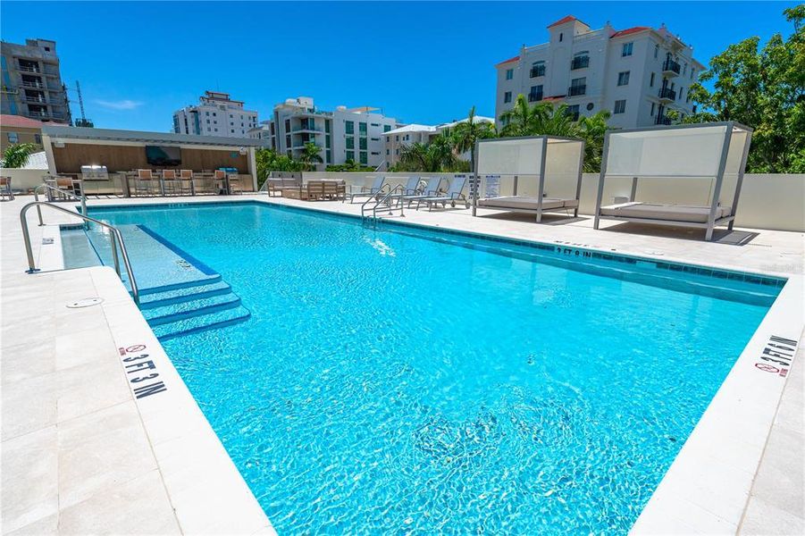 Resort pool with outdoor kitchen