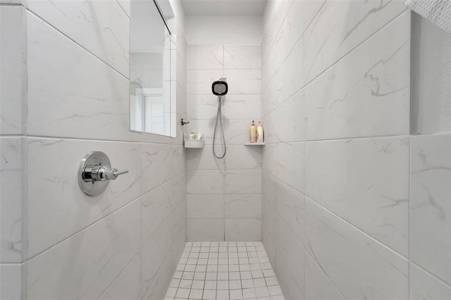 Bathroom with tiled shower