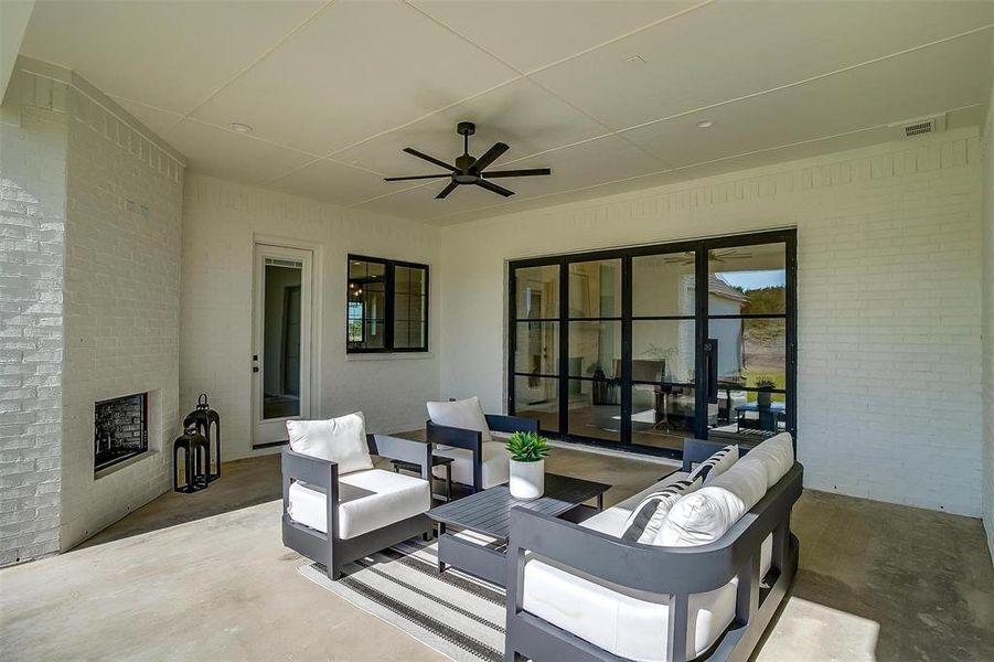 View of patio / terrace with an outdoor living space and ceiling fan