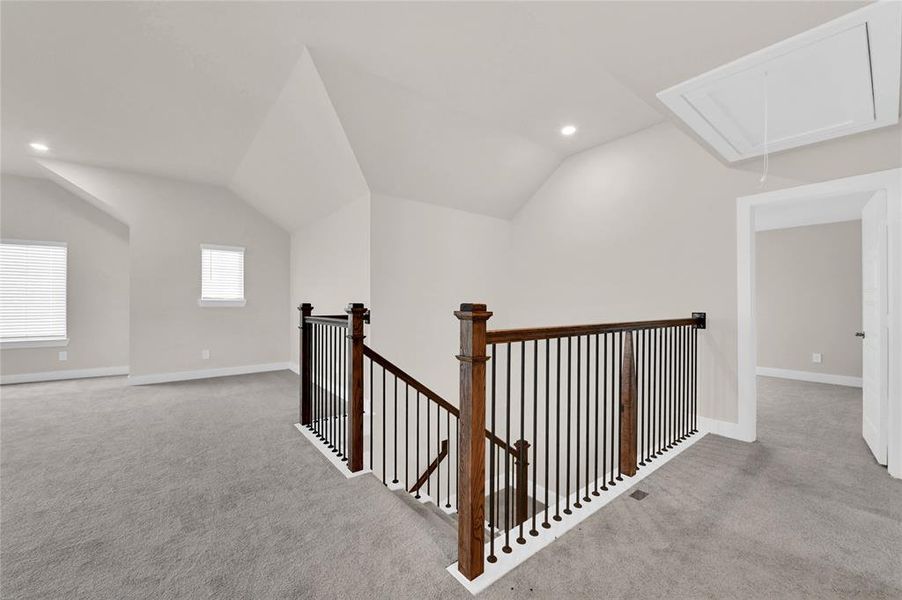 Atop the wrought iron spindled staircase, you'll find 3 spacious bedrooms, 1 full bathroom, and gameroom!