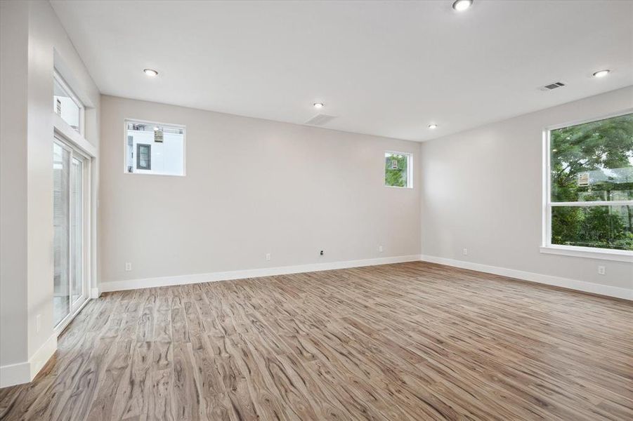 Living room with balcony, large windows