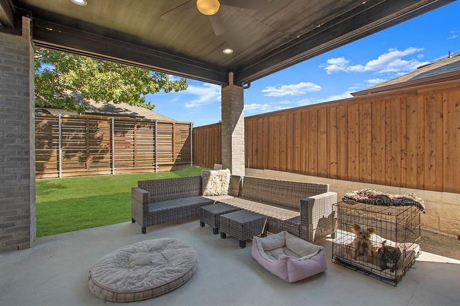 View of patio featuring outdoor lounge area and ceiling fan