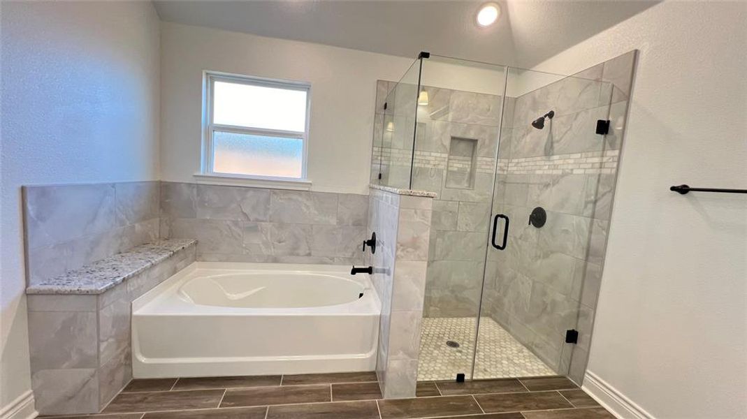 Bathroom featuring plus walk in shower