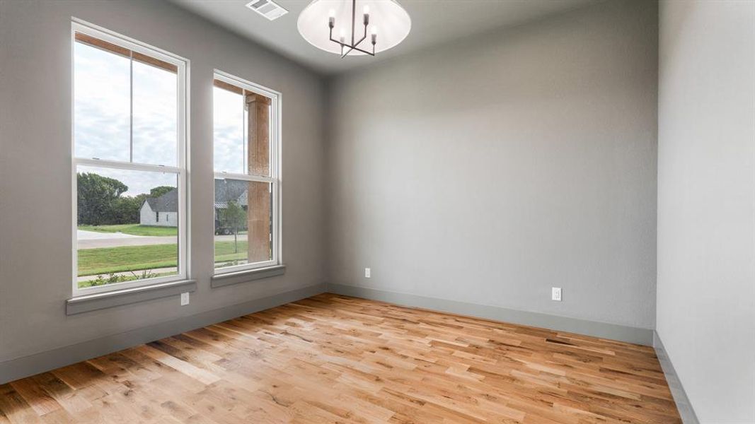 Spare room with light hardwood / wood-style floors