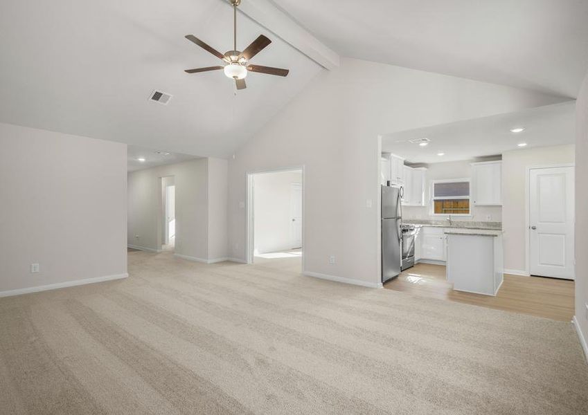 The family room features a beautiful high vaulted ceiling.