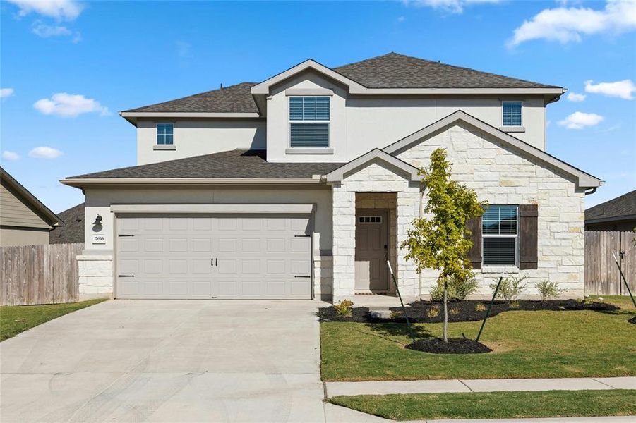 Beautiful Stone and Stucco Elevation with Single Garage Door for Easy Entry of Vehicle.