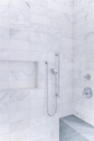 Bathroom featuring a tile shower