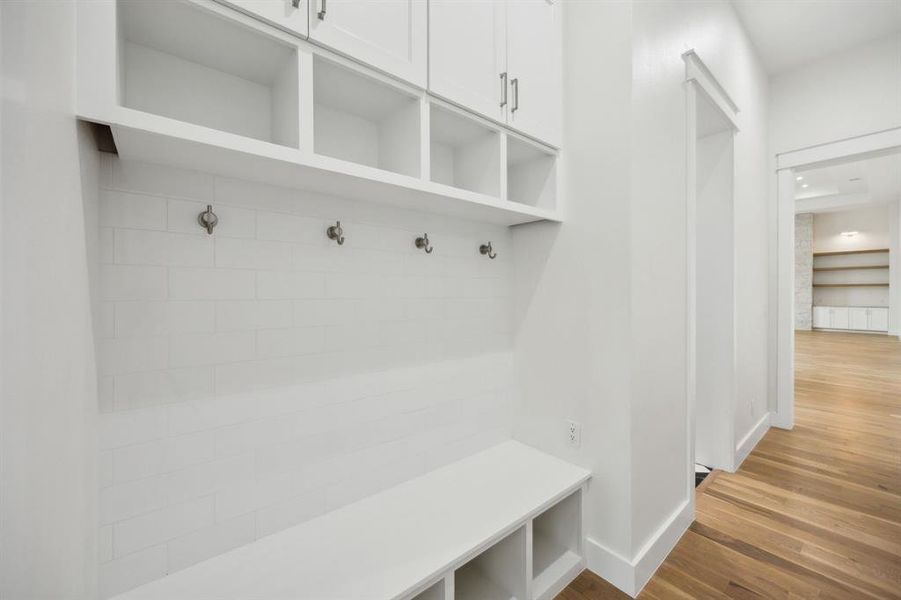 Mudroom featuring wood-type flooring