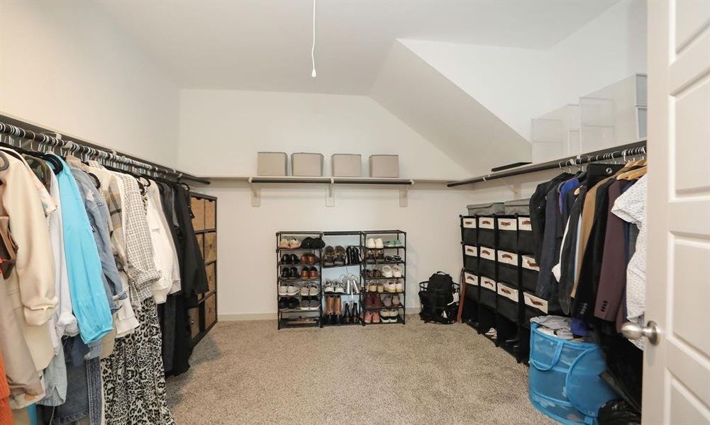 Primary bedroom large walk-in closet.