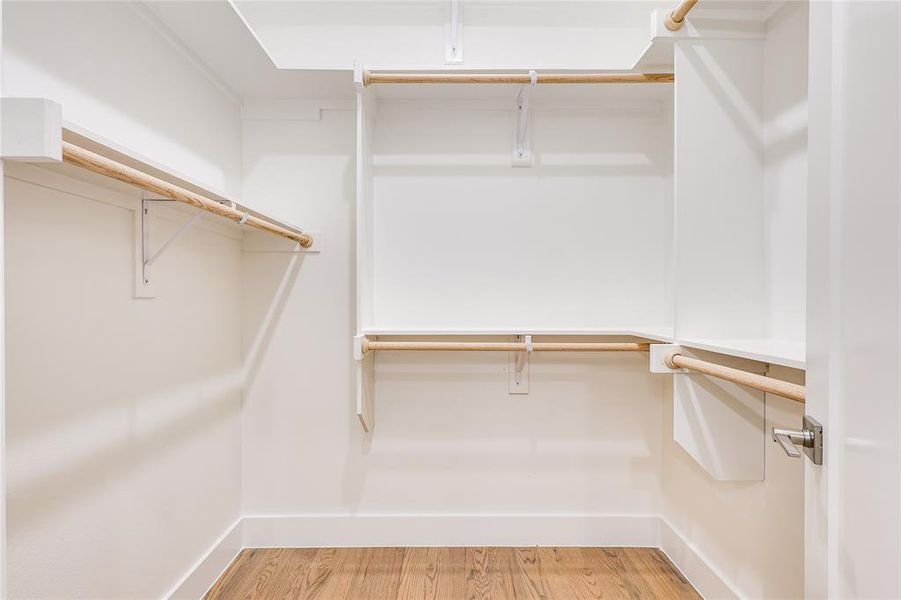 Walk in closet featuring hardwood / wood-style floors