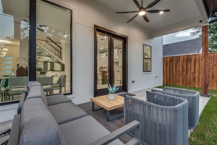 Outdoor patio with ceiling fan.