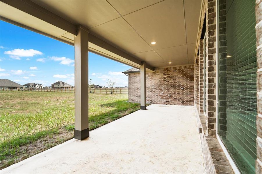 The large covered patio is finished off with recessed lighting and gas stub plus water & power .... just waiting for your outdoor kitchen. An ideal spot to unwind in the evening while stargazing.