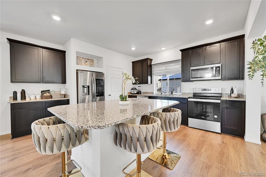 Enjoy the large, eat-in kitchen island, and bright and airy feeling.