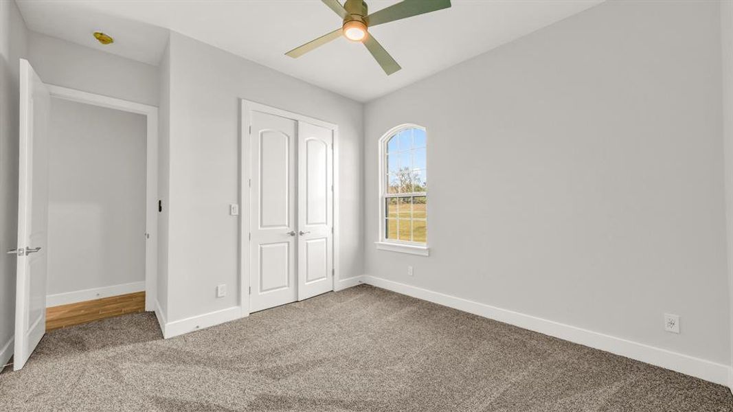 View of patio with a grill and ceiling fan