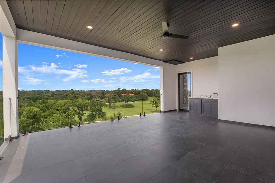 View of terrace featuring ceiling fan