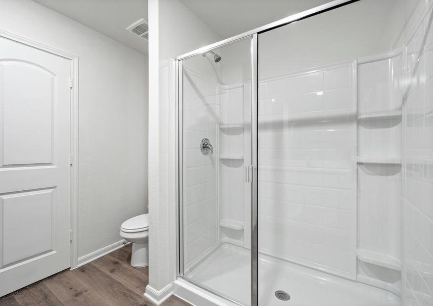 The master bathroom has a glass, walk-in shower.
