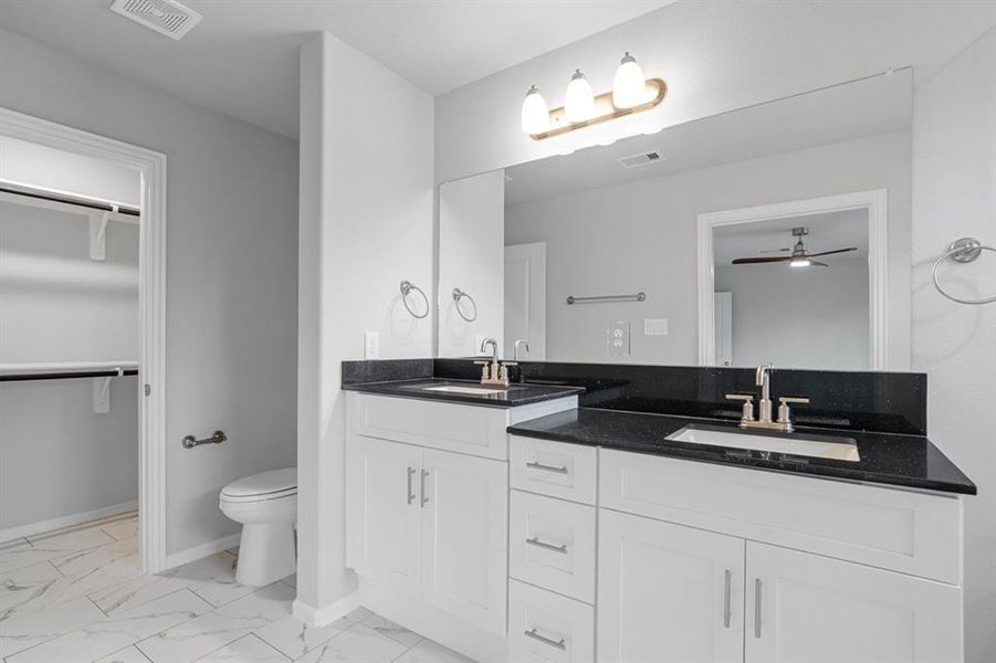 Master bath with smaller closet inside.