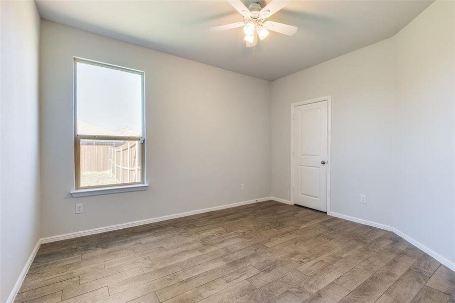 Spare room featuring light hardwood / wood-style flooring and ceiling fan