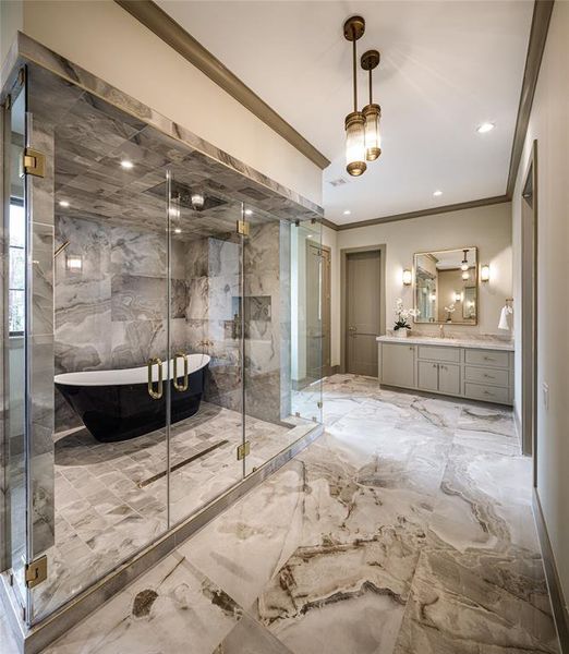 Custom built double glass door leading to the spa wash area. Gorgeous porcelain floors and elegant hanging pendants