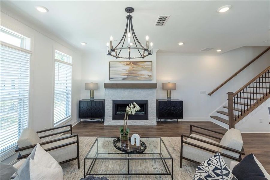 Living room , ornamental molding, and dark wood-type flooring, not the actual unit