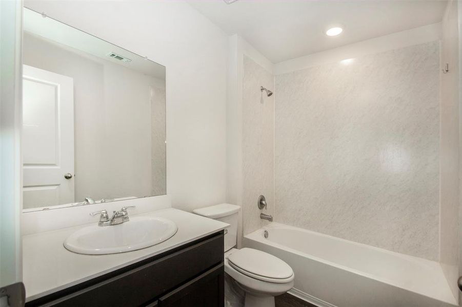 Full bathroom with vanity, toilet, and bathtub / shower combination