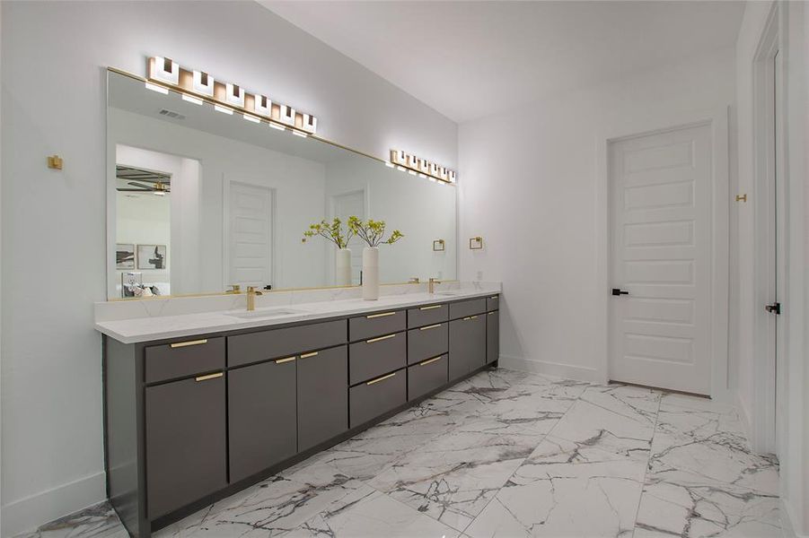 Bathroom with tile patterned floors, double sink vanity, and ceiling fan