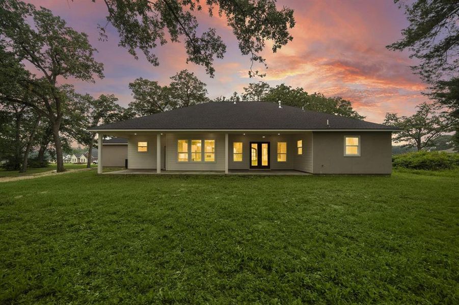 Enjoy the natural beauty and tranquility of this lush backyard space.