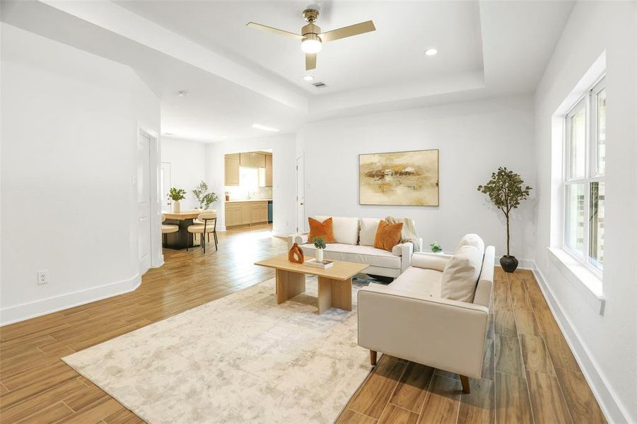 Spacious living room with 12-ft ceilings and LED lights.