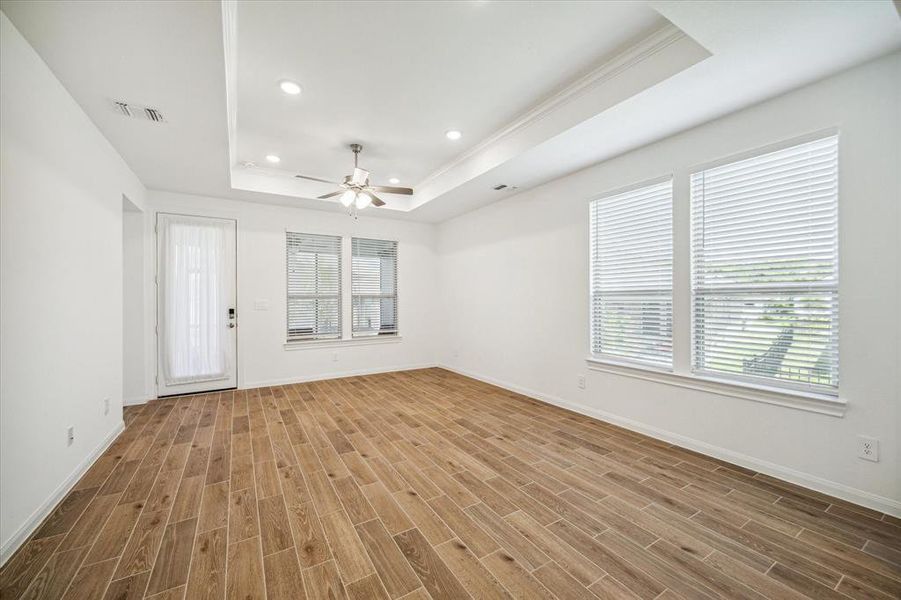 Open concept living. Living area leading to screened in porch